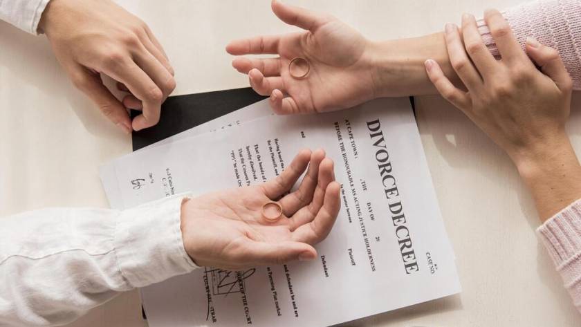 hands-with-divorce-decree-close-up