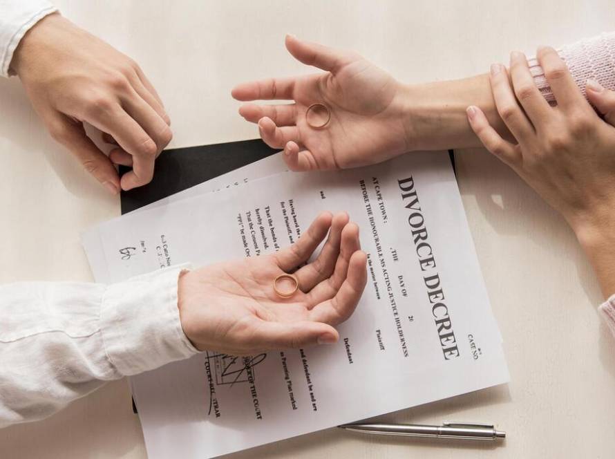 hands-with-divorce-decree-close-up